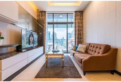 a living room with a couch and a flat screen tv at Dorsett Residence TRX KLCC #25 in Kuala Lumpur