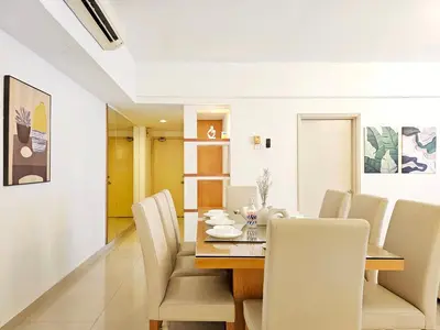 a dining room with a table and white chairs at Fahrenheit #185 Kuala Lumpur Bukit Bintang in Kuala Lumpur