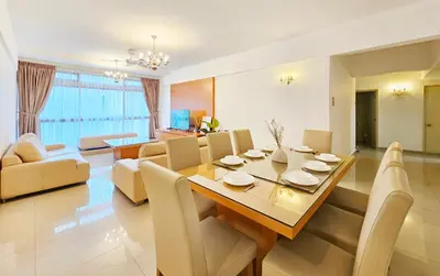 a dining room and living room with a table and chairs at Fahrenheit #185 Kuala Lumpur Bukit Bintang in Kuala Lumpur