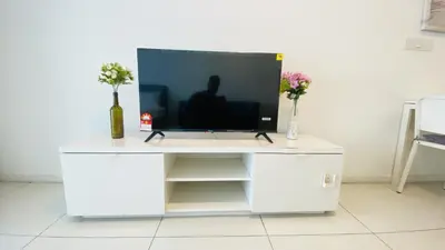 a white entertainment center with a television on it at Summer Suites by Western Holiday in Kuala Lumpur