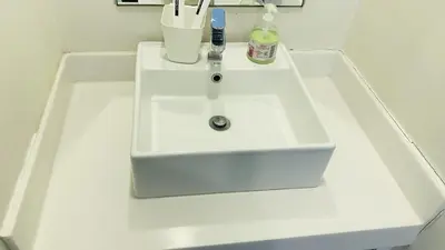 a white sink in a bathroom with at Summer Suites by Western Holiday in Kuala Lumpur