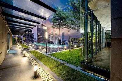 a building with a view of a city at night at Dorsett Residence #13 Kuala Lumpur Bukit Bintang TRX in Kuala Lumpur
