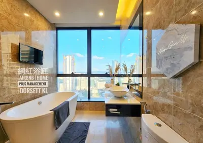 a bathroom with a tub and a sink and a large window at Dorsett Residence #13 Kuala Lumpur Bukit Bintang TRX in Kuala Lumpur