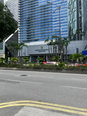 an empty street with a building in a city at Great Value 2-Bedroom KLCC Unit in Kuala Lumpur