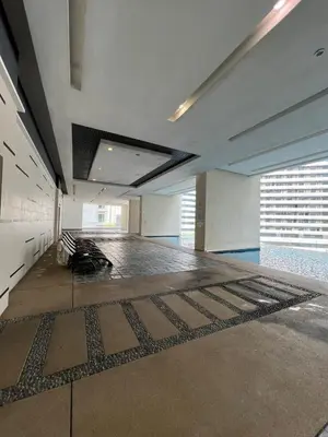 a large empty room with a floor with a rug at Great Value 2-Bedroom KLCC Unit in Kuala Lumpur