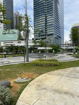 a park in the middle of a city with tall buildings at Great Value 2-Bedroom KLCC Unit in Kuala Lumpur
