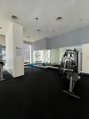 a gym with treadmills and exercise equipment in a building at Great Value City Center Unit in Kuala Lumpur