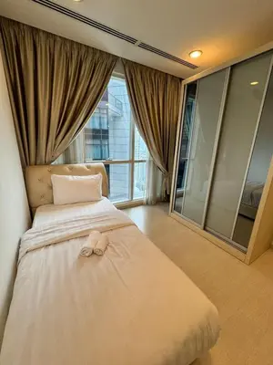 a bedroom with a bed with a towel on it at Great Value City Center Unit in Kuala Lumpur