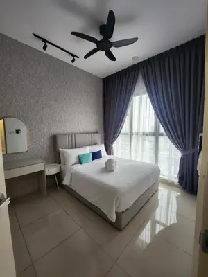 a bedroom with a bed and a ceiling fan at TRION Grand Service Suites at KL in Kuala Lumpur