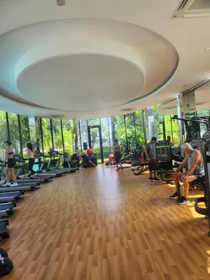 a gym with people exercising on tread machines at TRION Grand Service Suites at KL in Kuala Lumpur