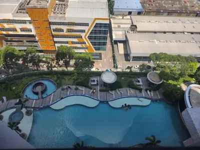 an overhead view of a swimming pool in a city at TRION Grand Service Suites at KL in Kuala Lumpur