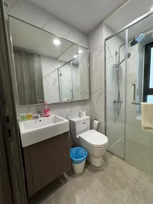 a bathroom with a sink and a toilet and a shower at AGILE Galaxy Suite in Kuala Lumpur