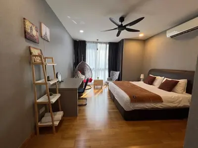 a bedroom with a bed and a ceiling fan at KL Gateway Residence Bangsar by The Luxe in Kuala Lumpur