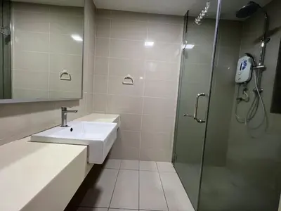 a bathroom with a sink and a shower at KL Gateway Residence Bangsar by The Luxe in Kuala Lumpur