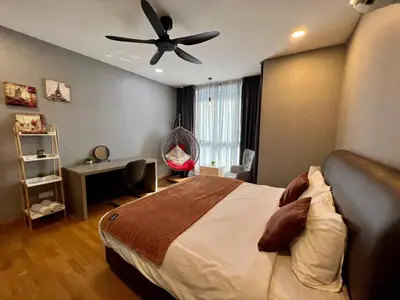 a bedroom with a bed and a ceiling fan at KL Gateway Residence Bangsar by The Luxe in Kuala Lumpur