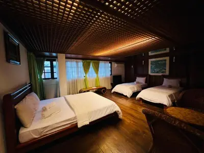 a bedroom with two beds in a room at Iviillainn in Kuala Lumpur
