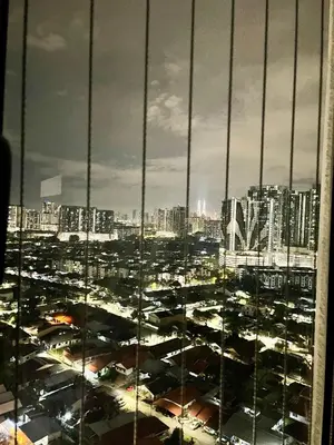 a view of a city from a skyscraper at Homestay Inspirasi in Kuala Lumpur