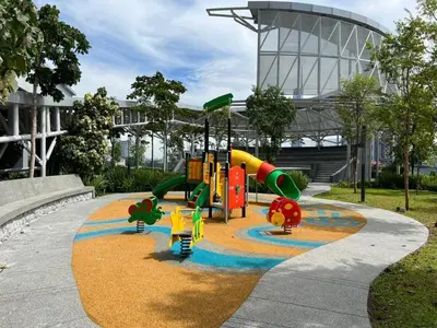 a playground in a park in front of a building at 9 Pax 3R3B Trion KL City View 10Mins to KLCC in Kuala Lumpur