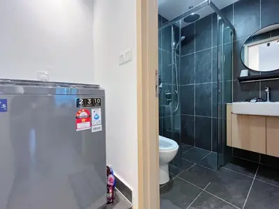 a bathroom with a shower and a toilet and a sink at The colony by Klcc view sweet home in Kuala Lumpur