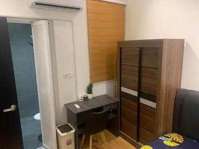 a small bathroom with a desk and a shower at Mini studio Neu suites KLCC in Kuala Lumpur