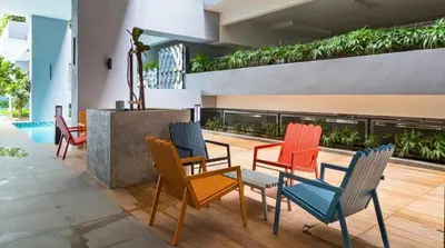 a group of chairs and a table in a building at Mini studio Neu suites KLCC in Kuala Lumpur