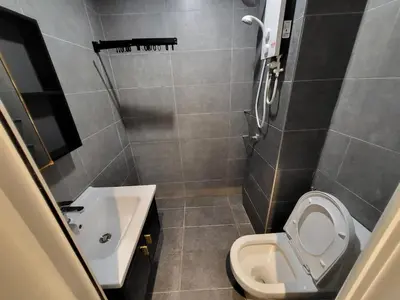 a small bathroom with a toilet and a sink at Private Room Queen Size KLCC in Kuala Lumpur