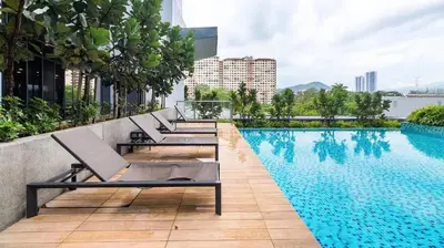 a pool on the roof of a building at Private Room Queen Size KLCC in Kuala Lumpur