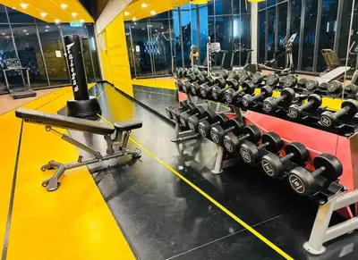 a row of dumbbells in a gym at Private Room Queen Size KLCC in Kuala Lumpur