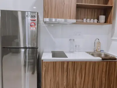 a kitchen with a stainless steel refrigerator and a sink at Cozy Kenwingston Platz KL 2-5 Pax 2BR & 2BR FrePakin Netflix 2802 in Kuala Lumpur