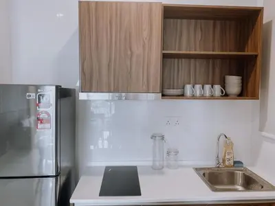 a kitchen with a stainless steel refrigerator and a sink at Cozy Kenwingston Platz KL 2-5 Pax 2BR & 2BR FrePakin Netflix 2802 in Kuala Lumpur
