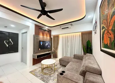 a living room with a couch and a ceiling fan at Homestay Inspirasi in Kuala Lumpur
