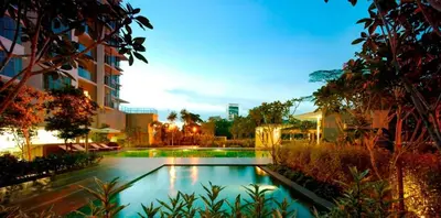a swimming pool in the middle of a building at Chic High-Floor 3BR Apt in Bukit Bintang in Kuala Lumpur