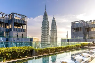 a view of the petronas twin towers from the city at Star Deluxe Suites KLCC by WSD in Kuala Lumpur
