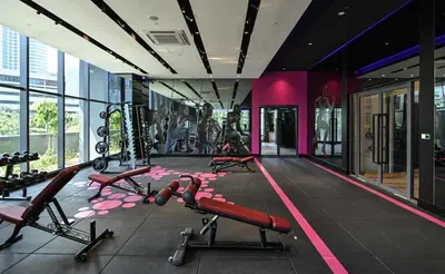a gym with cardio equipment in a building at Star Deluxe Suites KLCC by WSD in Kuala Lumpur