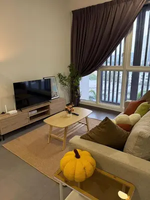 a living room with a couch and a tv at Sentrio Pandan Kuala Lumpur KLCC KL Tower TRX 10 in Kuala Lumpur