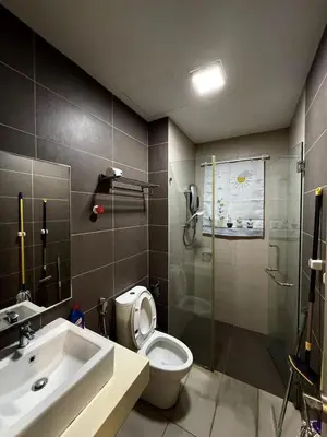 a bathroom with a shower and a toilet and a sink at Sentrio Pandan Kuala Lumpur KLCC KL Tower TRX 10 in Kuala Lumpur
