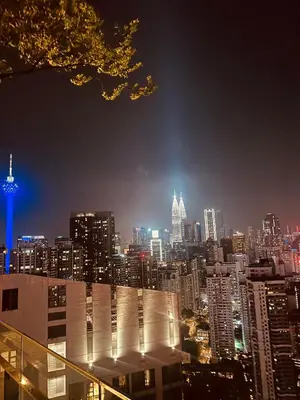 a view of a city skyline at night at The Robertson Residence Kuala Lumpur with City views in Kuala Lumpur