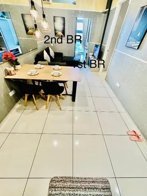 a dining room with a table and chairs at The Robertson Residence Kuala Lumpur with City views in Kuala Lumpur
