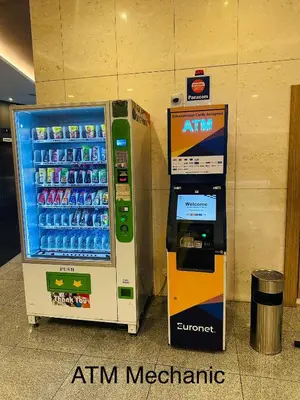 an atm machine is next to a drink vending machine at The Robertson Residence Kuala Lumpur with City views in Kuala Lumpur