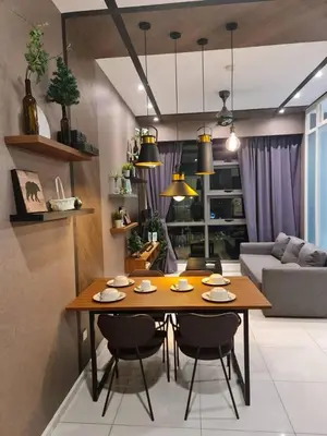 a living room with a table and chairs and a couch at The Robertson Residence Kuala Lumpur with City views in Kuala Lumpur