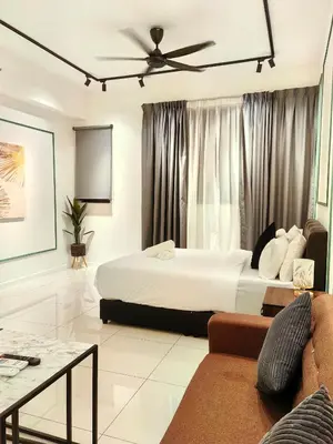 a hotel room with a bed and a couch at Chamber Resident Service KLCC in Kuala Lumpur