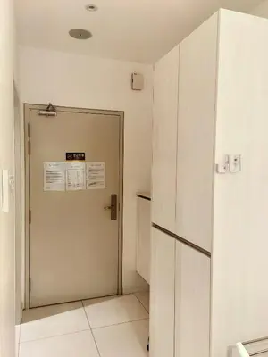 a room with a door and a refrigerator at Chamber Resident Service KLCC in Kuala Lumpur