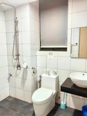 a bathroom with a toilet and a sink at Chamber Resident Service KLCC in Kuala Lumpur