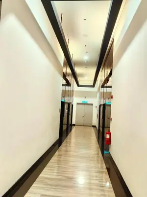 a hallway of an office building with a long corridor at Chamber Resident Service KLCC in Kuala Lumpur