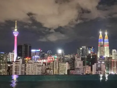 a view of a large city at night at Lucentia Residences in Kuala Lumpur