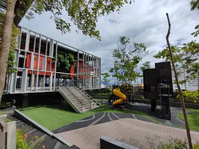 a building with a playground and a slide at Lucentia Residences in Kuala Lumpur