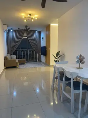 a living room with a white table and chairs at RumaDuke Kuala Lumpur with Netflix and KLCC Views in Kuala Lumpur