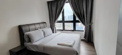 a bedroom with a bed and a large window at KLCC Agile Residences By Bukit Bentang Pevilion With Trx in Kuala Lumpur