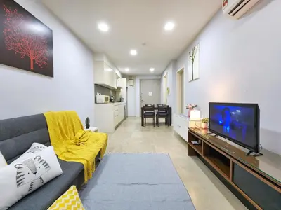 a living room with a couch and a flat screen tv at Bukit Bintang Fairlane Residence Kuala Lumpur #1510 in Kuala Lumpur