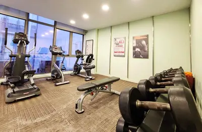 a gym with several treadmills and exercise bikes at Bukit Bintang Fairlane Residence Kuala Lumpur #1510 in Kuala Lumpur